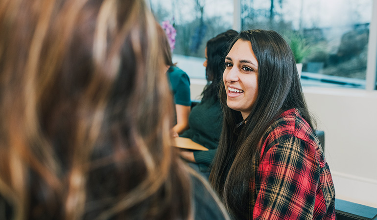 Woman talking to another woman in a group session